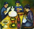 Tres mujeres en la mesa del expresionista de la lámpara